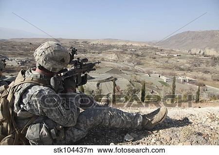 U. S Army soldier scans his sector of fire with his M14 rifle in Afghanistan. View Large Photo Image Picture - U. S Army soldier scans his sector of fire with his M14 rifle in Afghanistan.. Fotosearch