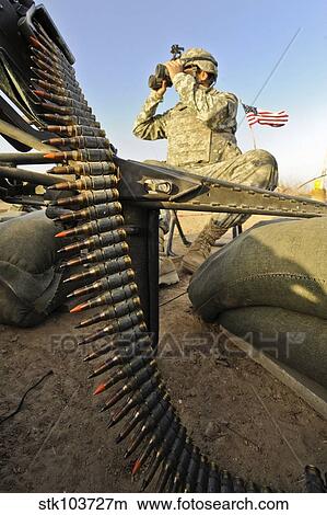 Picture - U. S. Army soldier scouts for enemy activity during an operation in Afghanistan.. Fotosearch