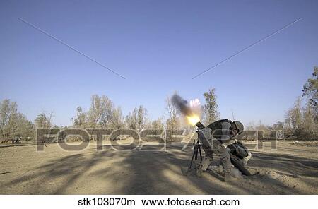 U. S. Army soldiers firing a 120-millimeter mortar round from Forward Operating Base Wilson in Iraq. View Large Photo Image Picture - U. S. Army soldiers firing a 120-millimeter mortar round from Forward Operating Base Wilson in Iraq.. Fotosearch