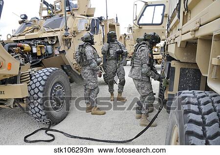 U. S. Army Soldiers jump start a light medium tactical vehicle. View Large Photo Image Picture - U. S. Army Soldiers jump start a light medium tactical vehicle.. Fotosearch