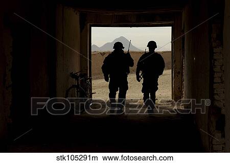 U. S. Army soldiers patrol a village in Afghanistan. View Large Photo Image Picture - U. S. Army soldiers patrol a village in Afghanistan.. Fotosearch