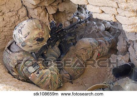 Picture - U. S. Army Specialist provides security inside an abandoned fortress.. Fotosearch