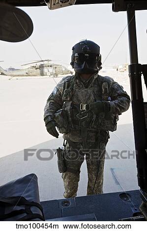 U. S. Army UH-60L Loadmaster confirms pre-fliight check on his aircraft. View Large Photo Image Picture - U. S. Army UH-60L Loadmaster confirms pre-fliight check on his aircraft.. Fotosearch