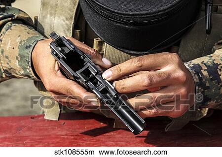 U. S. Marine assembles the M9 pistol. View Large Photo Image Picture - U. S. Marine assembles the M9 pistol.. Fotosearch