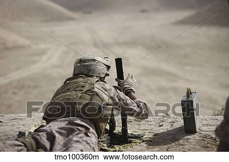 U. S. Marine clears a PK general-purpose machine gun. View Large Photo Image Picture - U. S. Marine clears a PK general-purpose machine gun.. Fotosearch