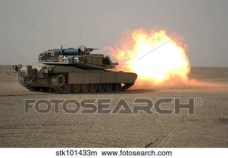 Picture - U. S. Marine Corps personnel fire their M1A1 Main Battle Tank gun.. Fotosearch