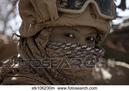 Picture - U. S. Marine covered in dirt during a convoy through Afghanistan.. Fotosearch