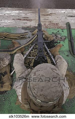 U. S. Marine fires an M2. 50-caliber machine gun. View Large Photo Image Picture - U. S. Marine fires an M2. 50-caliber machine gun.. Fotosearch