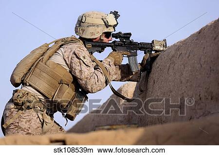 U. S. Marine provides security during a patrol in Afghanistan. View Large Photo Image Picture - U. S. Marine provides security during a patrol in Afghanistan.. Fotosearch