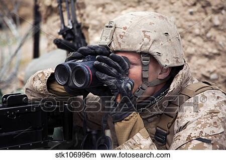 U. S. Marine scans for enemy positions during Operation Bullseye. View Large Photo Image Picture - U. S. Marine scans for enemy positions during Operation Bullseye.. Fotosearch