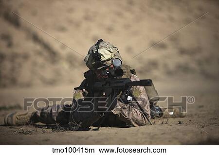 Picture - U. S. Marine sights in a Barrett M82A1 rifle.. Fotosearch