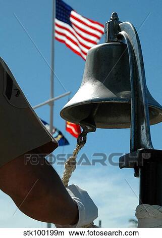U. S. Marine sounds a bell honoring fallen Marines during a ceremony. View Large Photo Image Picture - U. S. Marine sounds a bell honoring fallen Marines during a ceremony.. Fotosearch