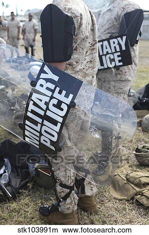 U. S. Marines and Sailors don riot gear for drills during Exercise Lethal Breeze. View Large Photo Image Picture - U. S. Marines and Sailors don riot gear for drills during Exercise Lethal Breeze.. Fotosearch