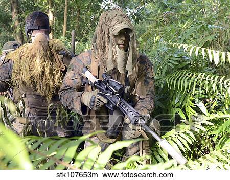 Picture - U. S. Marines and the Royal Malaysian Army conduct an amphibious raid exercise.. Fotosearch