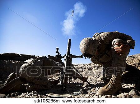 U. S. Marines brace themselves while firing a 60mm mortar round. View Large Photo Image Picture - U. S. Marines brace themselves while firing a 60mm mortar round.. Fotosearch
