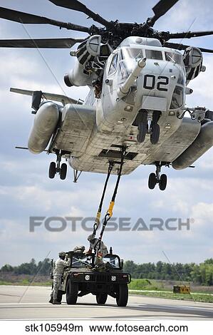 Picture - U. S. Marines conduct a sling load operation with a CH-53E Super Stallion.. Fotosearch
