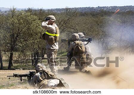 Picture - U. S. Marines employ an AT-4 light anti-armor weapon during live-fire training.. Fotosearch