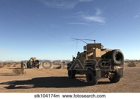Picture - U. S. Marines guide M-ATV's through the Arizona desert.. Fotosearch