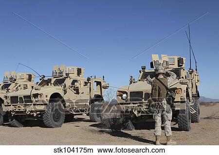U. S. Marines guides a Mine Resistant Ambush Protected all-terrain vehicle. View Large Photo Image Picture - U. S. Marines guides a Mine Resistant Ambush Protected all-terrain vehicle.. Fotosearch