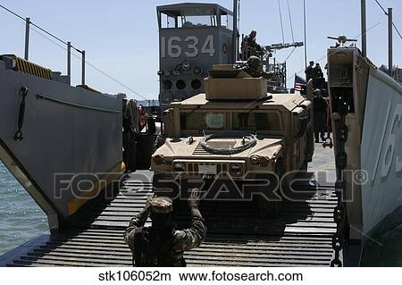 U. S. Marines load an M1114 Humvee onto a landing craft utility. View Large Photo Image Picture - U. S. Marines load an M1114 Humvee onto a landing craft utility.. Fotosearch