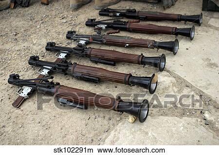 Picture - U. S. Marines make an inventory of weapons found on a cache site.. Fotosearch