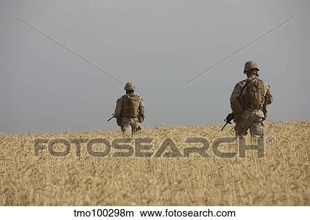U. S. Marines patrol a wadi near Kunduz, Afghanistan. View Large Photo Image Picture - U. S. Marines patrol a wadi near Kunduz, Afghanistan.. Fotosearch