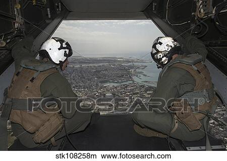U. S. Marines peer out the back of an MV-22 Osprey tiltrotor aircraft. View Large Photo Image Picture - U. S. Marines peer out the back of an MV-22 Osprey tiltrotor aircraft.. Fotosearch