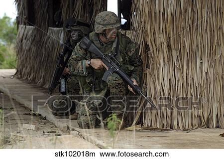 U. S. Marines prepare to enter a house during a raid. View Large Photo Image Picture - U. S. Marines prepare to enter a house during a raid.. Fotosearch