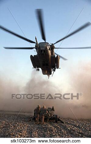 U. S. Marines preparing to attach an M777A2 Lightweight Howitzer to a CH-53E Super Stallion helicopter. View Large Photo Image Picture - U. S. Marines preparing to attach an M777A2 Lightweight Howitzer to a CH-53E Super Stallion helicopter.. Fotosearch