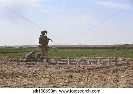 U. S. Marines provide security during a patrol in Afghanistan. View Large Photo Image Picture - U. S. Marines provide security during a patrol in Afghanistan.. Fotosearch