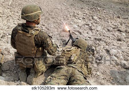 U. S. Marines provide suppressive fire with an M240B machine gun. View Large Photo Image Picture - U. S. Marines provide suppressive fire with an M240B machine gun.. Fotosearch