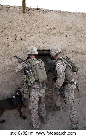 U. S. Marines push down a wall in an empty compound. View Large Photo Image Picture - U. S. Marines push down a wall in an empty compound.. Fotosearch