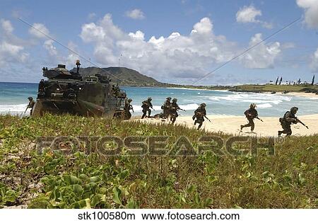 U. S. Marines run out of an Amphibious Assault Vehicle. View Large Photo Image Picture - U. S. Marines run out of an Amphibious Assault Vehicle.. Fotosearch