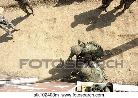 U. S. Marines throws a practice grenade into a room to clear it before they enter. View Large Photo Image Picture - U. S. Marines throws a practice grenade into a room to clear it before they enter.. Fotosearch
