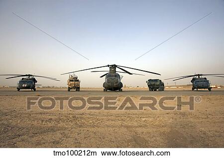 U. S. military vehicles and aircraft lined up on the taxiway at Camp Speicher, Iraq. View Large Photo Image Picture - U. S. military vehicles and aircraft lined up on the taxiway at Camp Speicher, Iraq.. Fotosearch