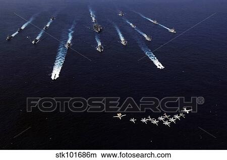 U. S. Navy aircraft fly over a formation of U. S. and Japanese ships. View Large Photo Image Picture - U. S. Navy aircraft fly over a formation of U. S. and Japanese ships.. Fotosearch