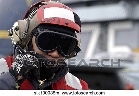 Picture - U. S. Navy Aviation Ordnanceman reports the ordnance inventory.. Fotosearch