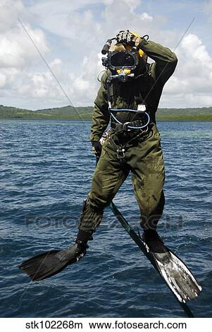 U. S. Navy Diver jumps off a dive station. View Large Photo Image Picture - U. S. Navy Diver jumps off a dive station.. Fotosearch