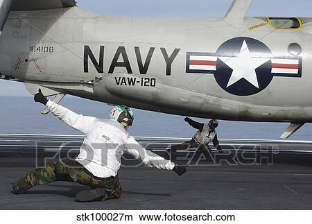 U. S. Navy Sailors give the thumbs up signal before launching a E-2C Hawkeye. View Large Photo Image Picture - U. S. Navy Sailors give the thumbs up signal before launching a E-2C Hawkeye.. Fotosearch