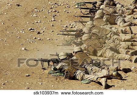 Picture - U. S. Navy Seabees fire M-4 and M-16A2 rifles.. Fotosearch