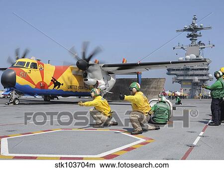 U. S. Navy shooters launch a C-2A Greyhound aircraft from the aircraft carrier USS George H. W. Bush. View Large Photo Image Picture - U. S. Navy shooters launch a C-2A Greyhound aircraft from the aircraft carrier USS George H. W. Bush.. Fotosearch