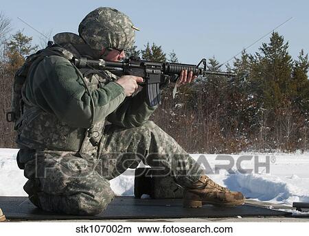 U. S. soldier fires his M4A3 Carbine at Fort McCoy, Wisconsin. View Large Photo Image Picture - U. S. soldier fires his M4A3 Carbine at Fort McCoy, Wisconsin.. Fotosearch