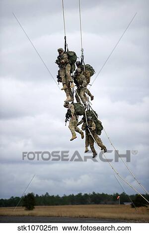 U. S. Soldiers are lifted off the ground by a CH-47 Chinook helicopter. View Large Photo Image Picture - U. S. Soldiers are lifted off the ground by a CH-47 Chinook helicopter.. Fotosearch