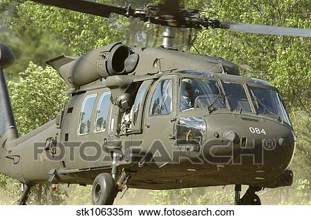 U. S. Soldiers conduct an air assault mission in an UH-60M Black Hawk. View Large Photo Image Picture - U. S. Soldiers conduct an air assault mission in an UH-60M Black Hawk.. Fotosearch