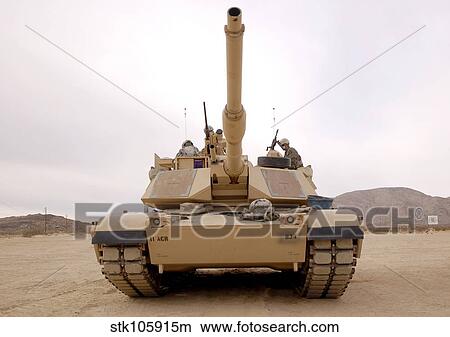 Picture - U. S. soldiers perform maintenance on their M1 Abrams tank.. Fotosearch