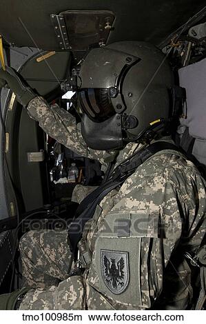 UH-60 Black Hawk crew chief. View Large Photo Image Picture - UH-60 Black Hawk crew chief.. Fotosearch
