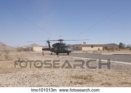 UH-60 Black Hawk helicopter lands on the street in New Mexico. View Large Photo Image Picture - UH-60 Black Hawk helicopter lands on the street in New Mexico.. Fotosearch