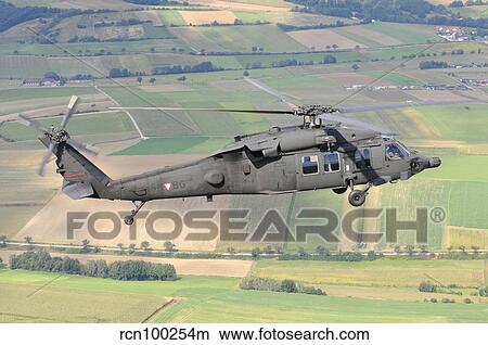UH-60 Black Hawk helicopter of the Austrian Air Force in flight. View Large Photo Image Picture - UH-60 Black Hawk helicopter of the Austrian Air Force in flight.. Fotosearch