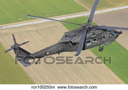 UH-60 Black Hawk helicopter of the Austrian Air Force in flight. View Large Photo Image Picture - UH-60 Black Hawk helicopter of the Austrian Air Force in flight.. Fotosearch