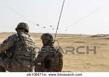 UH-60 Black Hawk helicopters prepare to airdrop soldiers in Kuwait. View Large Photo Image Picture - UH-60 Black Hawk helicopters prepare to airdrop soldiers in Kuwait.. Fotosearch